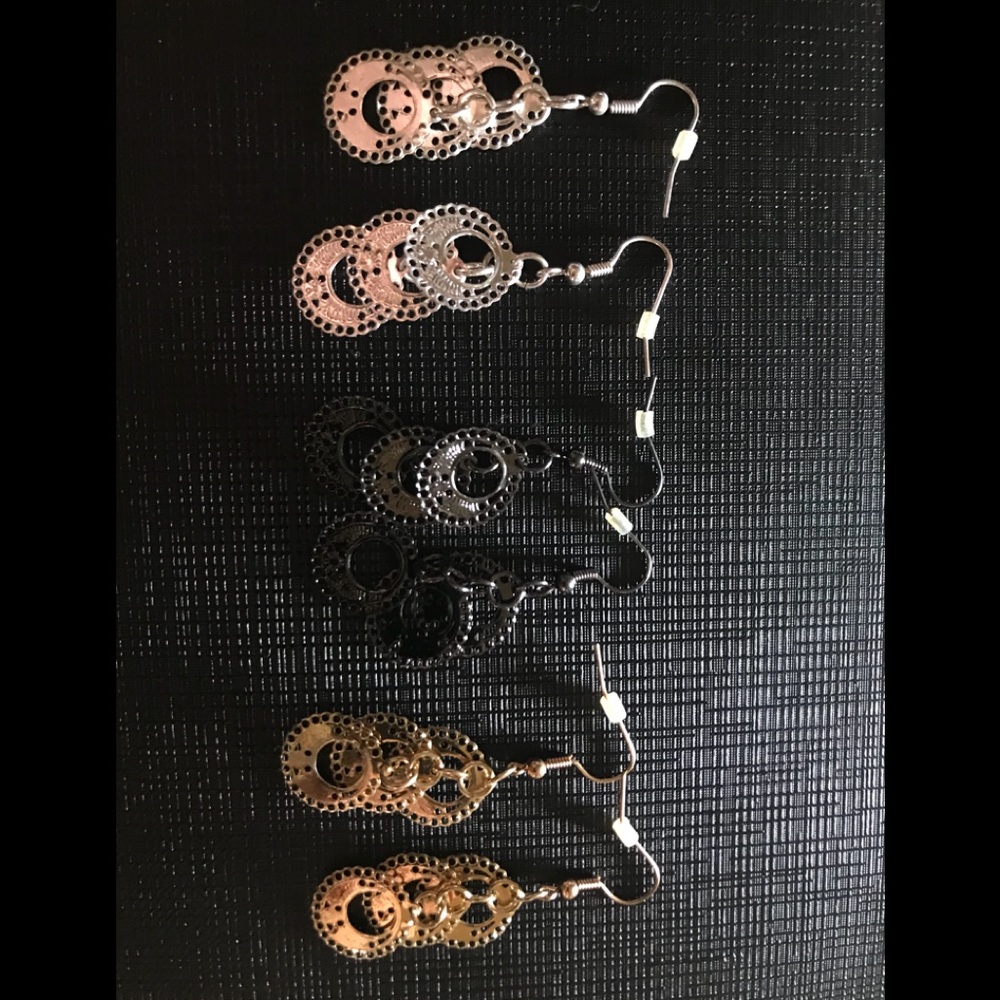 Black, silver, and gold earrings
